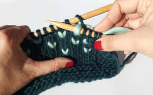 Person Knitting Dark Green Yarn Wallpaper