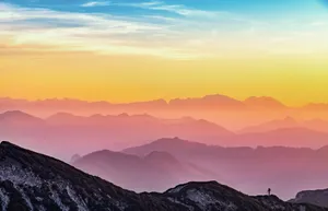 Person On Mountain Banner Wallpaper