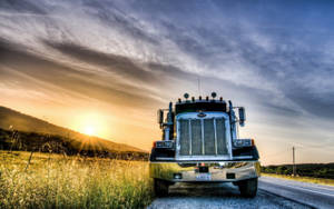 Peterbilt Truck In A Grassland Street Wallpaper