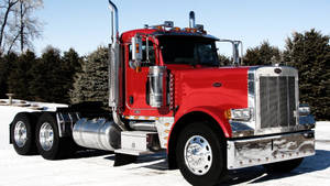 Peterbilt Truck On A Snowy Street Wallpaper