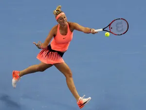 Petra Kvitova Jumping And Hitting Ball Wallpaper