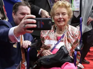 Phyllis Schlafly Posing For A Selfie With A Supporter Wallpaper