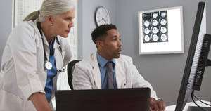 Physicians Examining X-ray Wallpaper