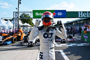 Pierre Gasly, Formula One Racer, Positioned On His Race Track. Wallpaper