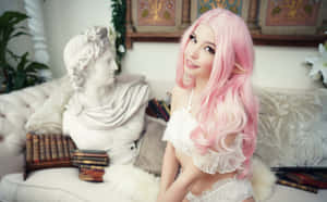 Pink Haired Cosplayerwith Statue Wallpaper