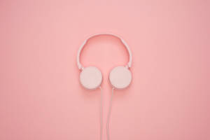 Pink Headphone In Plain Color Wallpaper