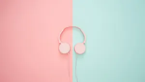 Pink Headphones On A Pink And Blue Background Wallpaper
