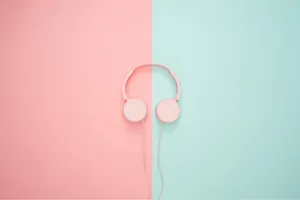 Pink Headphones On A Pink And Blue Background Wallpaper