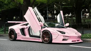 Pink Lamborghini With Doors Open Wallpaper