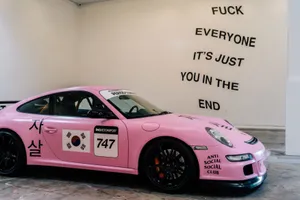 Pink Sedan Showcasing Anti Social Club Logo Wallpaper