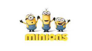 Playful Minion Trio Striking A Pose Wallpaper