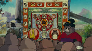 Playful Tanukis From Pom Poko In A Heartwarming Scene Wallpaper