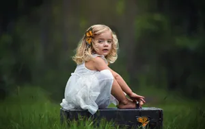 Playful Vibes: Charming Lady With Black Tool Box Wallpaper