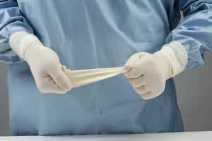 Pliable Surgeon Gloves Wallpaper