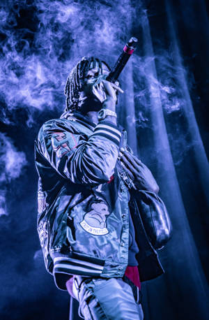 Polo G Singing In Concert Wallpaper