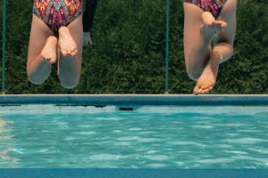 Pool Pair Jumping Wallpaper