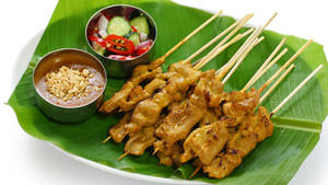 Pork Satay Southeast Asian Dish On Banana Leaf Wallpaper