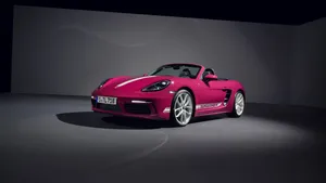 Porsche Boxster - Pink Sports Car In A Dark Room Wallpaper