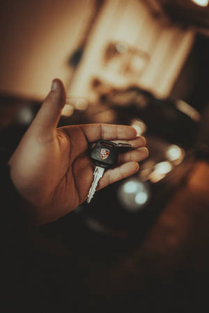 Porsche Key On Hand Wallpaper