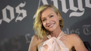 Portia De Rossi Smiling Event Appearance Wallpaper