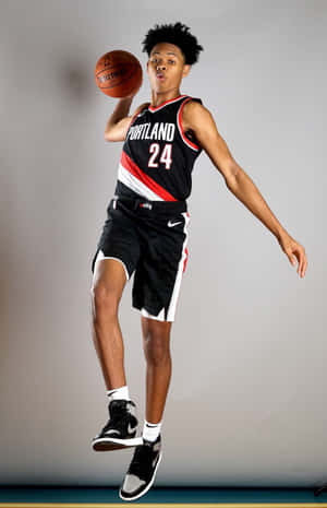 Portland Basketball Player Mid Air Pose Wallpaper