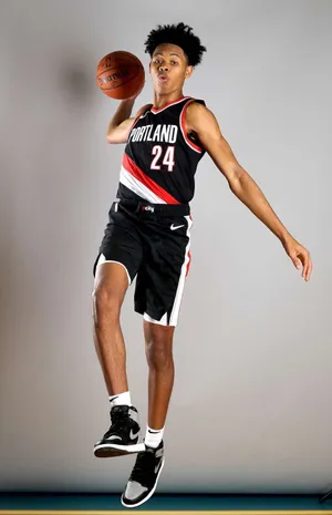 Portland Basketball Player Mid Air Pose Wallpaper