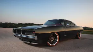 Powerful Dodge Charger In Action Wallpaper