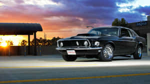 Powerful Ford Mustang Mach 1 Muscle Car In Action Wallpaper