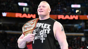 Powerhouse Wwe Athlete, Brock Lesnar, In Action Wallpaper