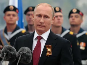 President Vladimir Putin Engaged In A Serious Gaze With The Camera. Wallpaper