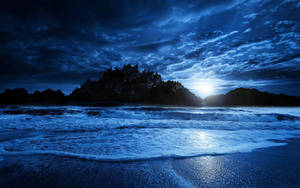 Pretty Blue Beach With Foamy Waves Wallpaper