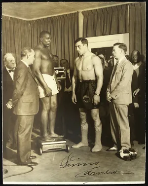 Primo Carnera During A Pre-fight Weigh-in Wallpaper