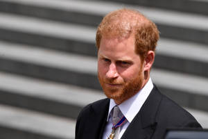 Prince Harry Exuding Confidence And Royal Sophistication Wallpaper