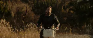 Prisoners Of The Ghostland Hero Riding Bike Wallpaper