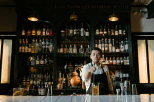 Professional Bartender Preparing Drink Wallpaper