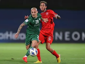 Professional Footballer Alexandru Mitrita In Action For Al Ahli Saudi Football Club Wallpaper