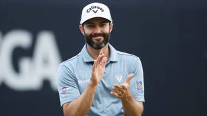 Professional Golfer Adam Hadwin Swinging For Victory Wallpaper