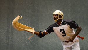 Professional Jai Alai Player In Action Wallpaper