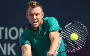 Professional Tennis Player Jack Sock Demonstrating His Focused Match Stance Wallpaper