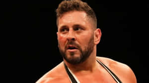 Professional Wrestler In Ring Action Wallpaper