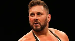 Professional Wrestler In Ring Action Wallpaper