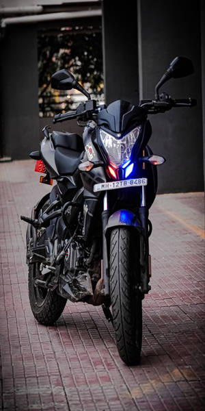 Pulsar 150 Beside Building Wallpaper