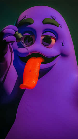 Purple_ Character_ Grimacing_with_ Tongue_ Out Wallpaper