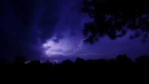 Purple Lightning With Dark Clouds Wallpaper