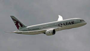 Qatar Airways Braving The Dark Clouds Wallpaper