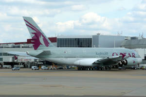 Qatar Airways Taxies On The Runway Wallpaper