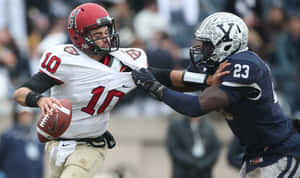 Quarterback_ Evading_ Defender Wallpaper