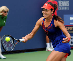 Radiant Ana Ivanovic Powers Through A Tennis Match Wallpaper