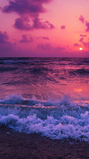Raging Ocean Waves Over Aesthetic Sunset Wallpaper