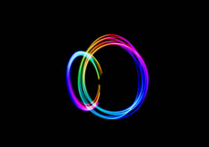 Rainbow Circles On A Dark Background Wallpaper